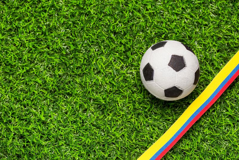 sports field synthetic grass with a ball and tape on it