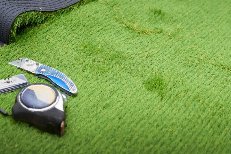 surveyors tape and artificial grass cutter