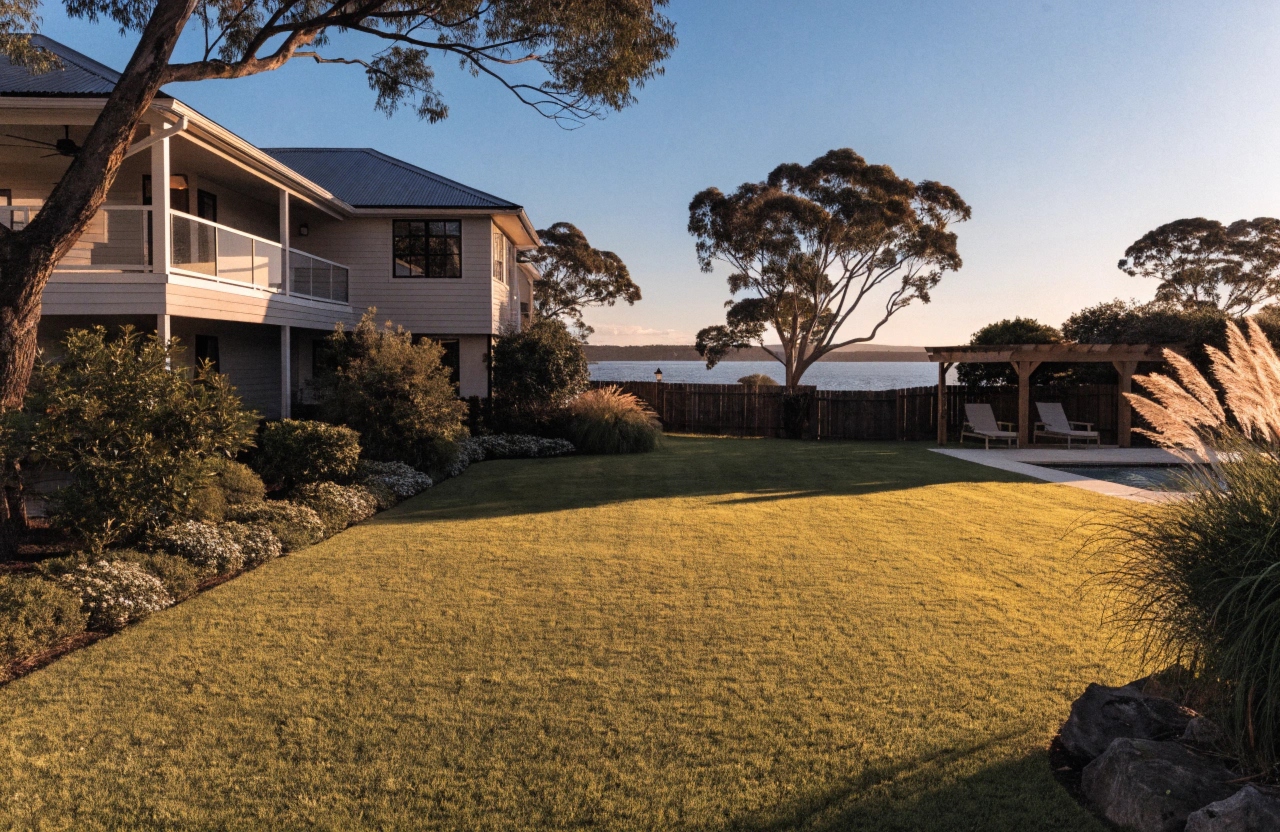 Synthetic turf lawn at a waterfront property in Lake Macquarie with pool surround and lake views
