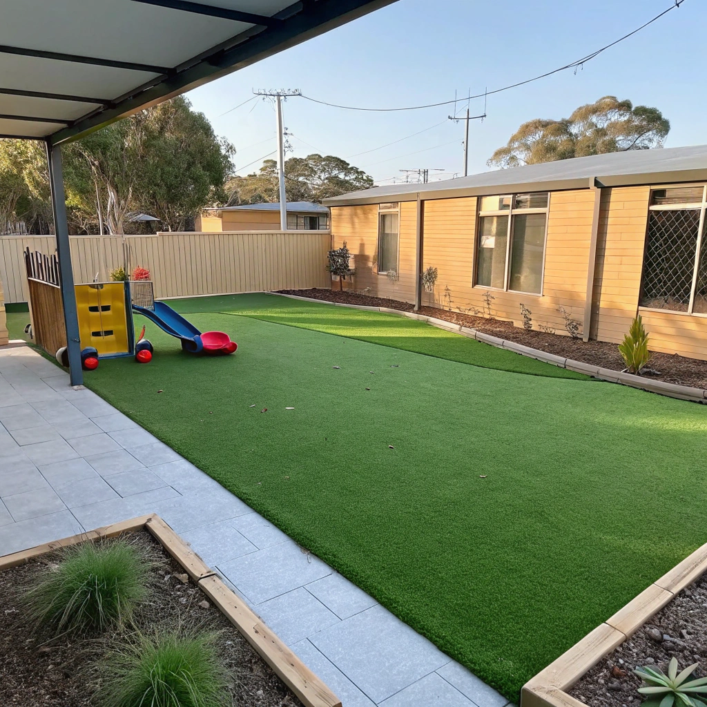 Completed synthetic turf installation in a childcare centre outdoor play area on the Central Coast